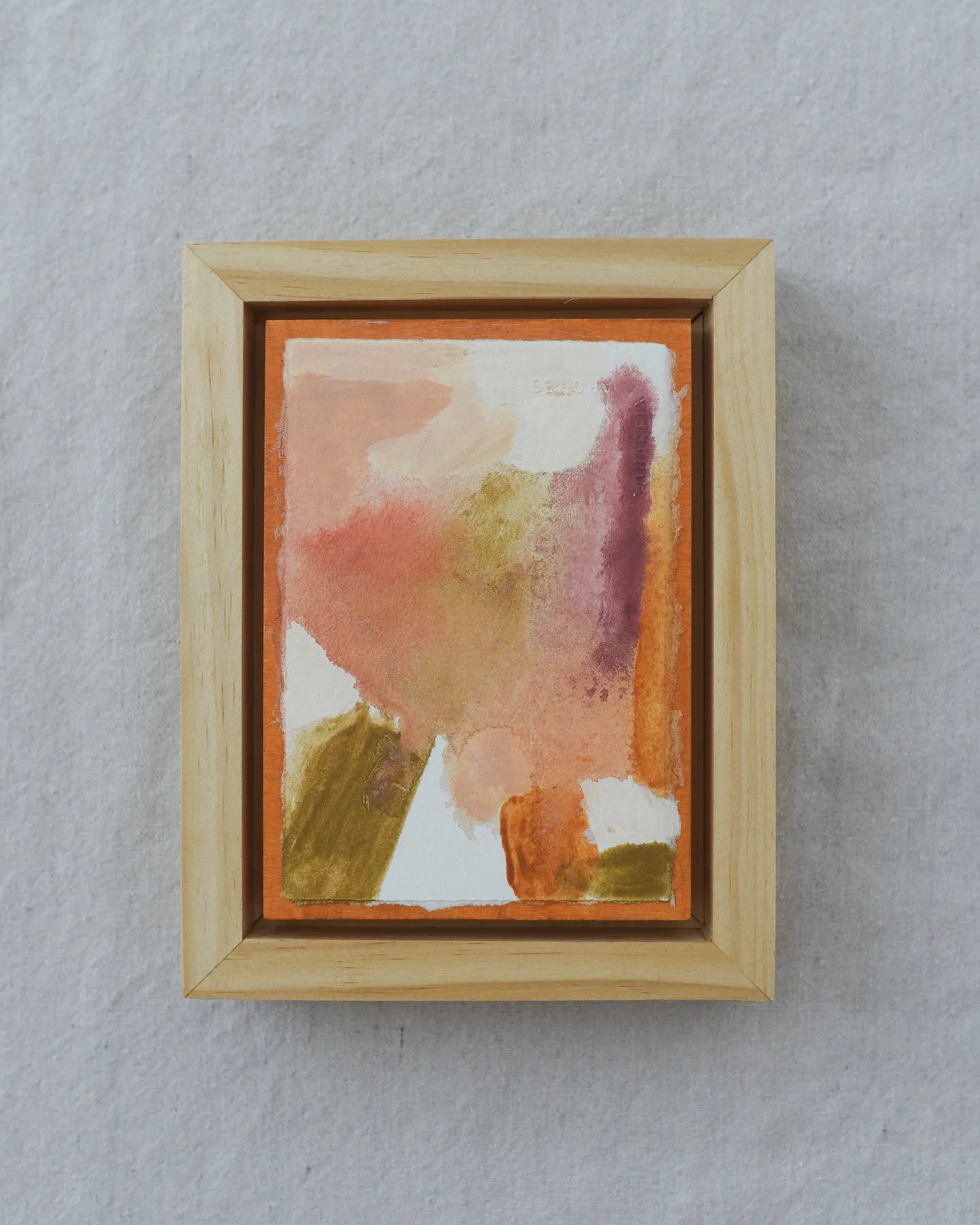 This intuitive abstract blends white, peach, soft pink, light olive green, and raw sienna, with a subtle hint of magenta.