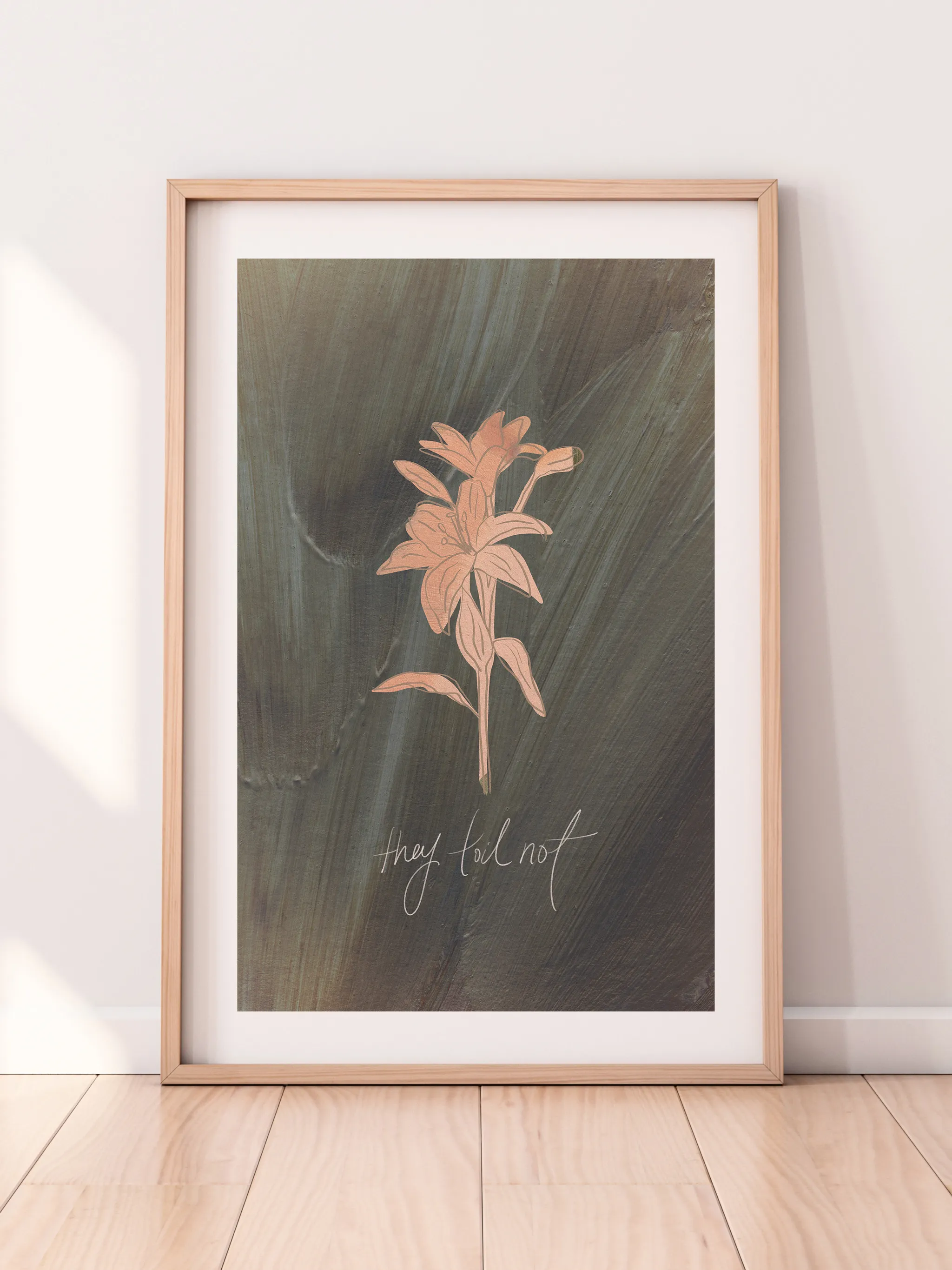Consider the Lilies on Green, framed in light wood with a white mat, leaning against a pale wall on a light wood floor.