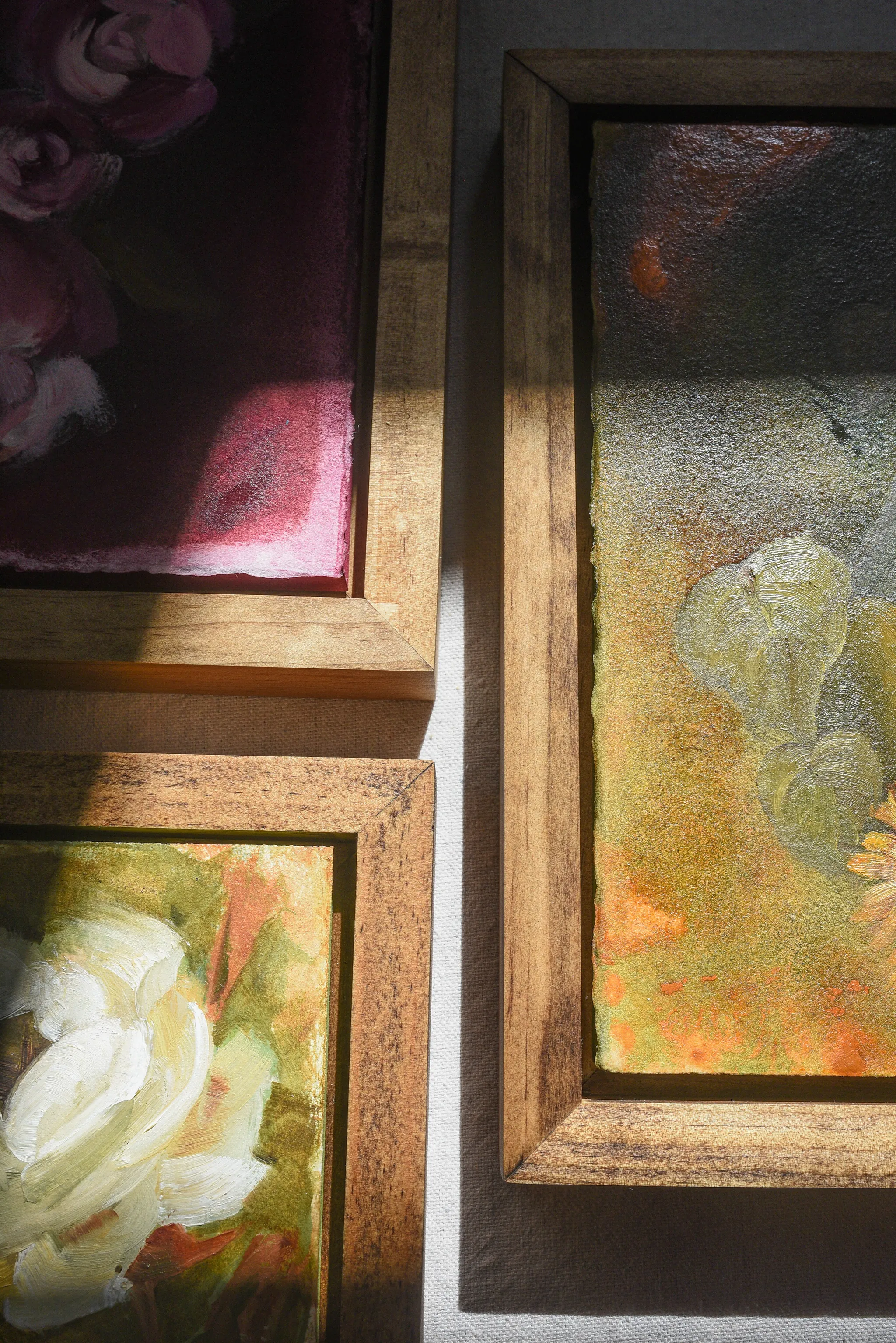 Enduring Bloom, view 8 of 9: A creamy white rose against a warm green and soft yellow background, showcasing rich texture and depth through subtle color shifts.