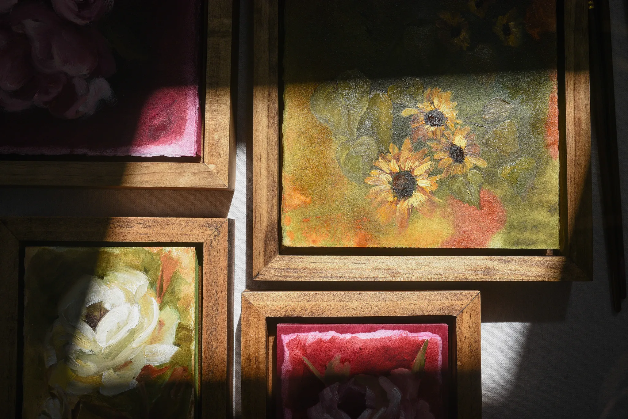 Enduring Bloom, view 9 of 9: A creamy white rose against a warm green and soft yellow background, showcasing rich texture and depth through subtle color shifts.