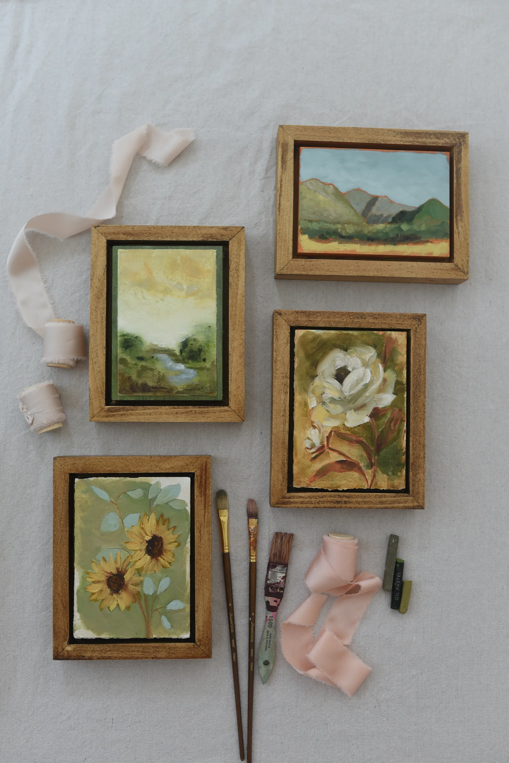 Harmony Bloom, view 12 of 12: three sunflowers radiating warmth against a light green backdrop, interwoven with delicate eucalyptus.