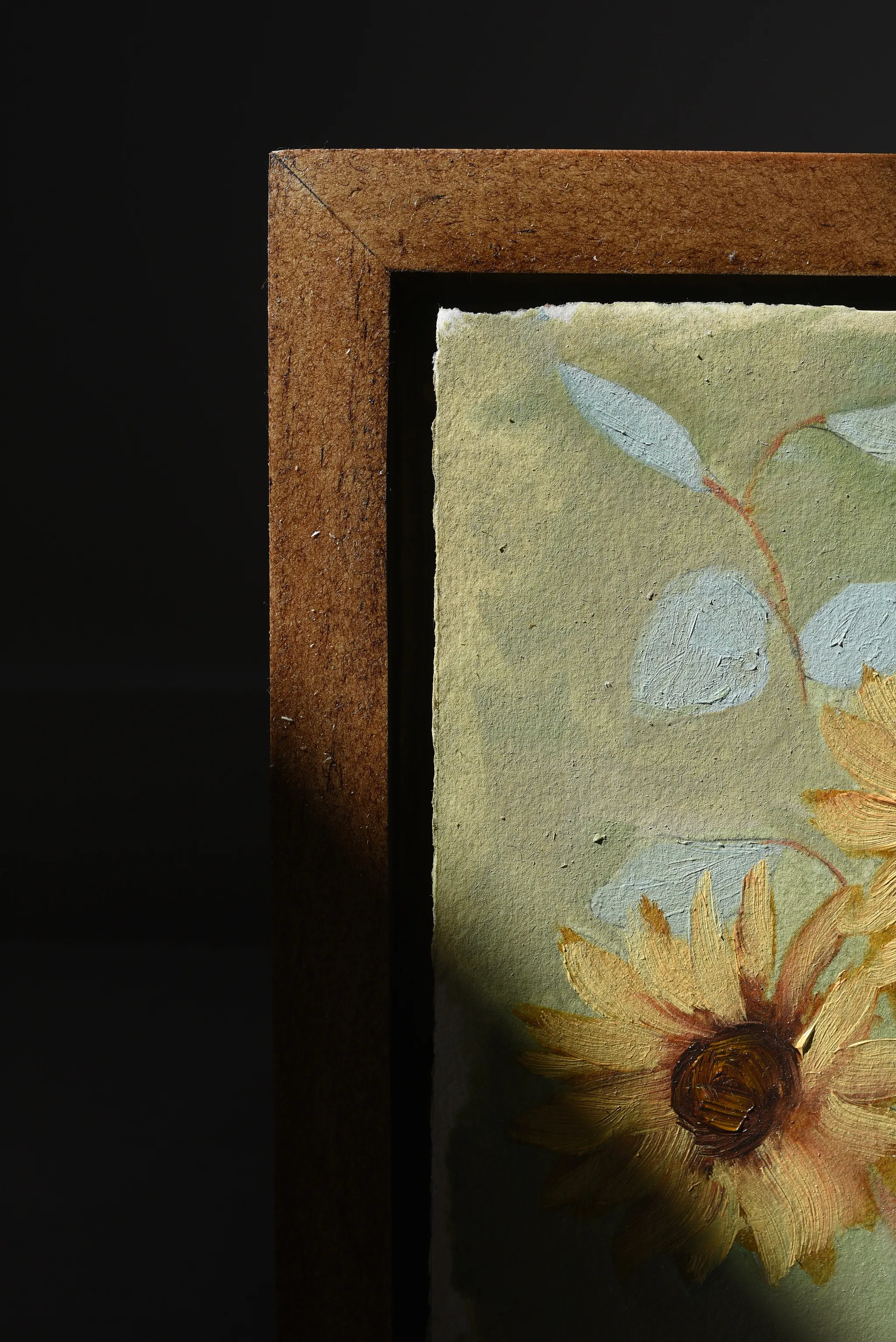 Harmony Bloom, view 6 of 12: three sunflowers radiating warmth against a light green backdrop, interwoven with delicate eucalyptus.