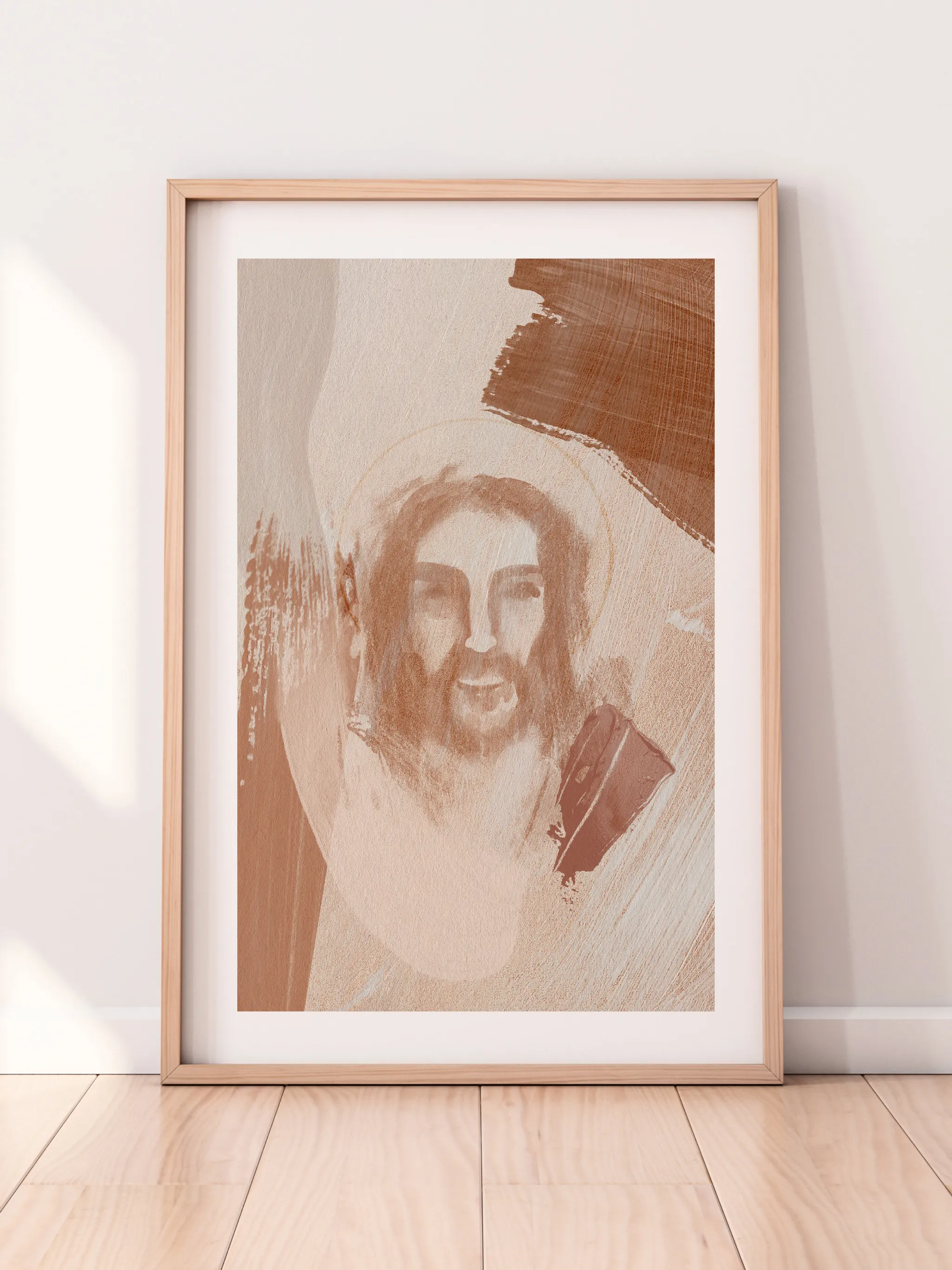 Jesus Portrait Watercolor V, framed in light wood with a white mat, leaning against a pale wall on a light wood floor.