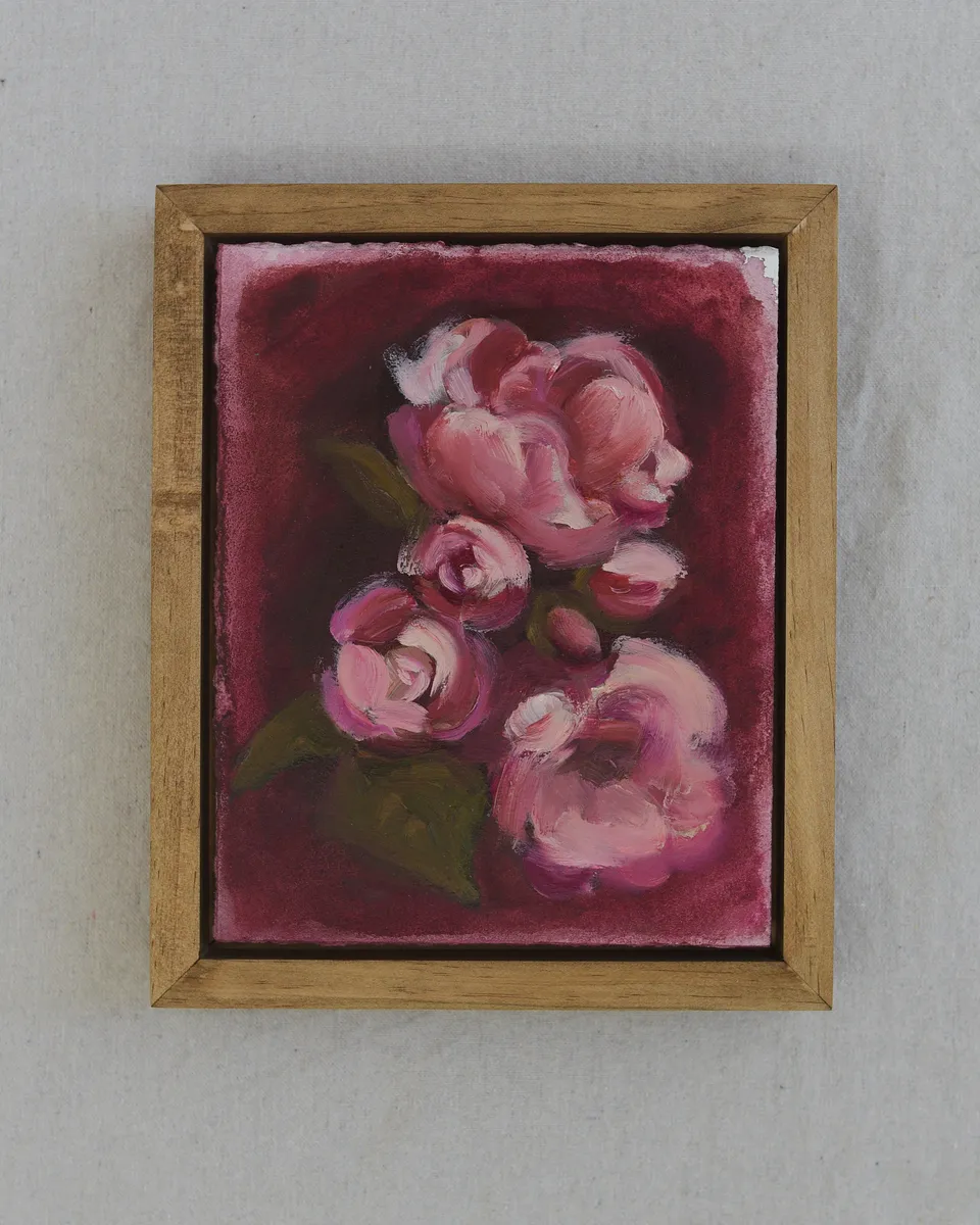 Light pink flowers dance across a deep magenta background, their soft petals contrasted by the vibrant warmth of the scene.