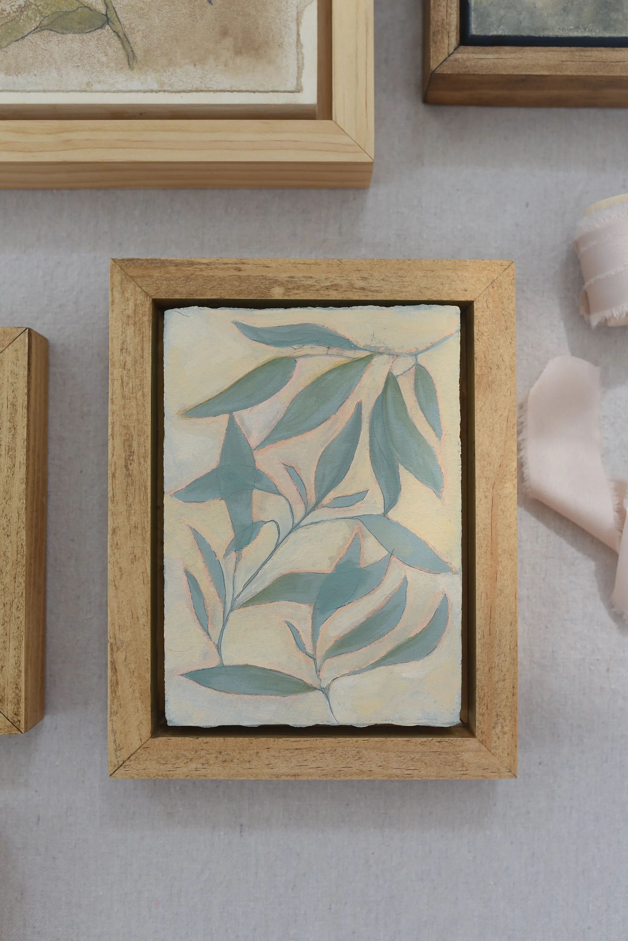 Refreshing Bloom, view 10 of 12: mint-colored leaves gently resting on a creamy vanilla background, with subtle hints of peach.