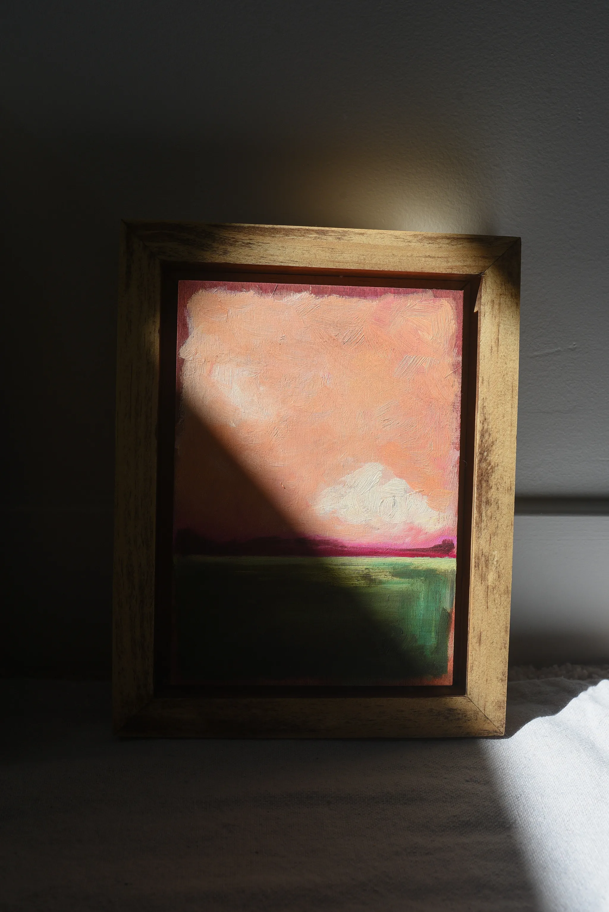 Reverie, view 5 of 12: A striking peach and deep magenta sky adorned with soft clouds, set against a backdrop of deep lush green.