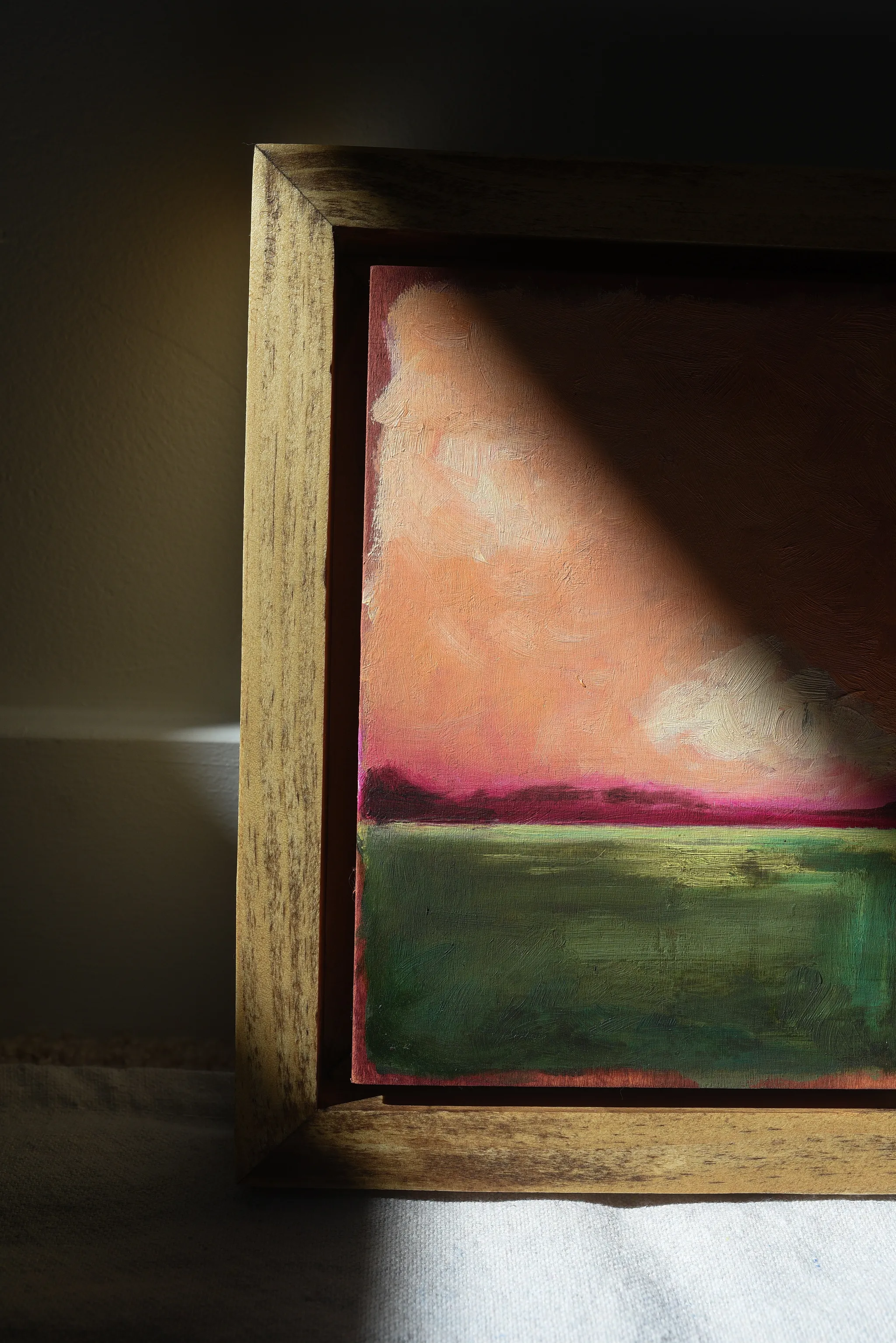 Reverie, view 6 of 12: A striking peach and deep magenta sky adorned with soft clouds, set against a backdrop of deep lush green.